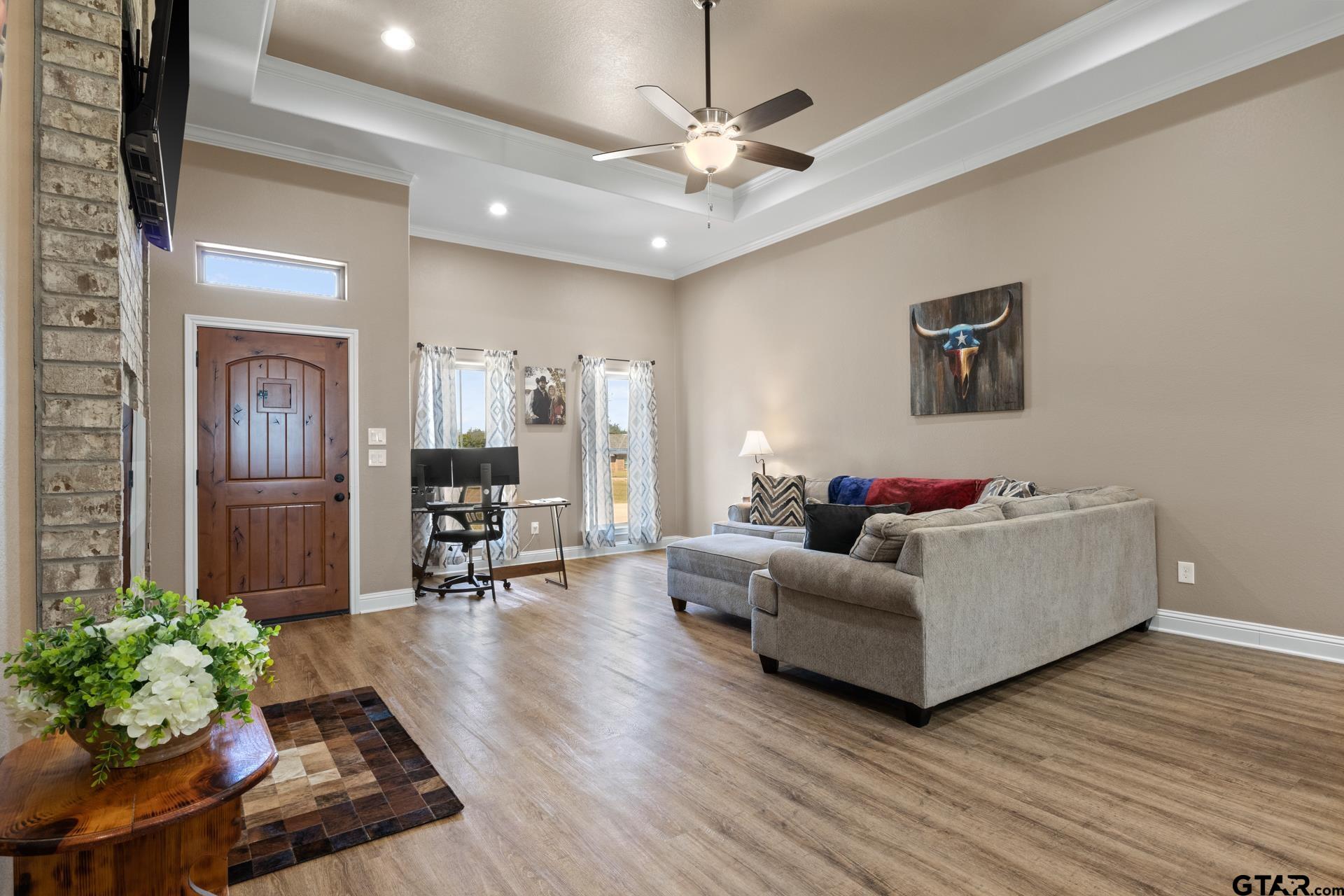 25 Private Road Pittsburg, TX 75686 - Photo 6 of 29 a living room with furniture and a chandelier