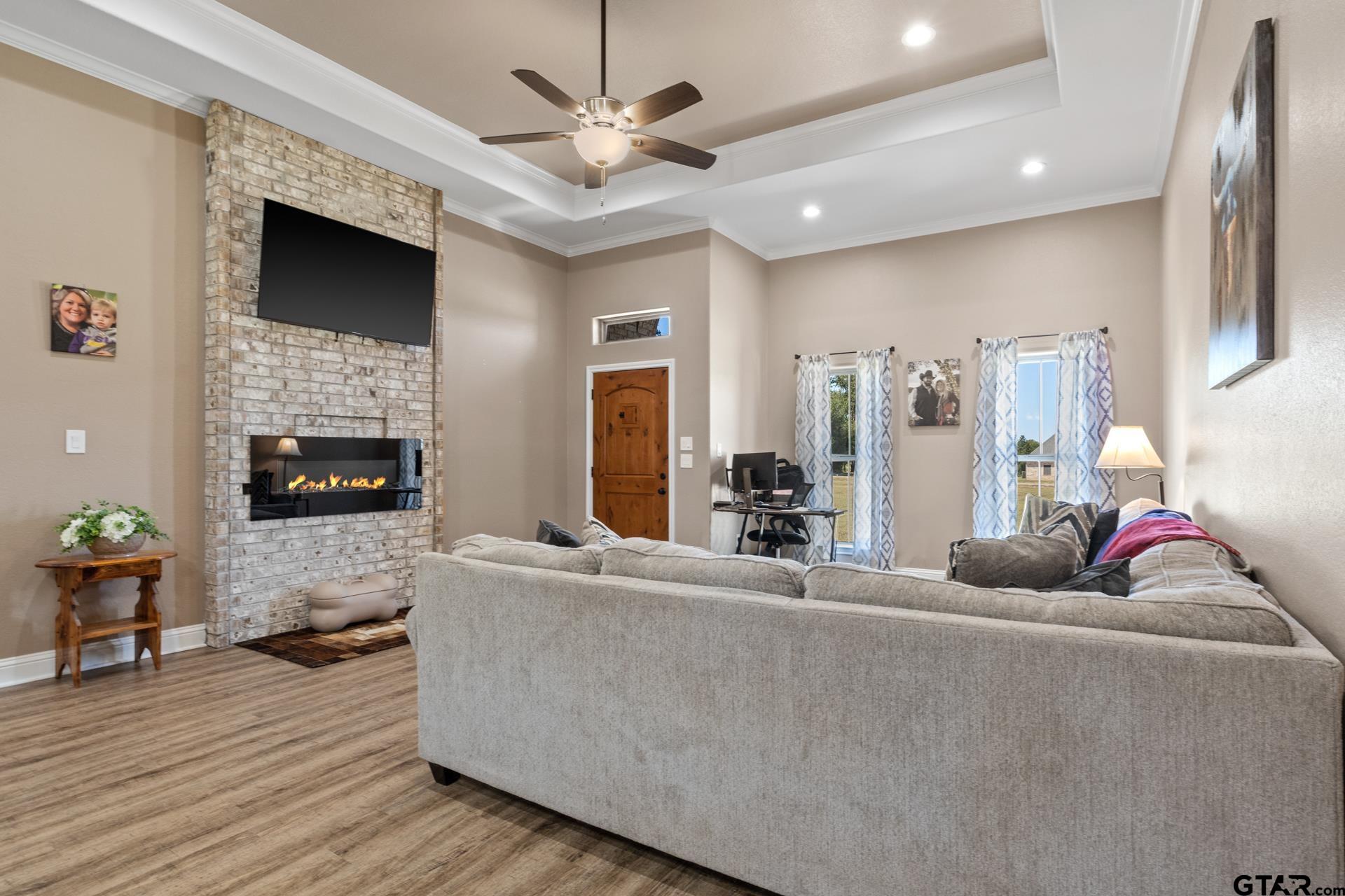 25 Private Road Pittsburg, TX 75686 - Photo 7 of 29 a living room with furniture fireplace and flat screen tv