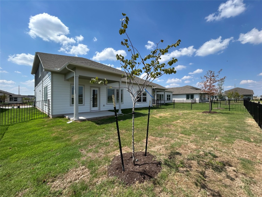 4304 Forel Road Pflugerville, TX 78660 - Photo 5 of 9 Back of property with a patio area, a fenced backyard, and roof with shingles