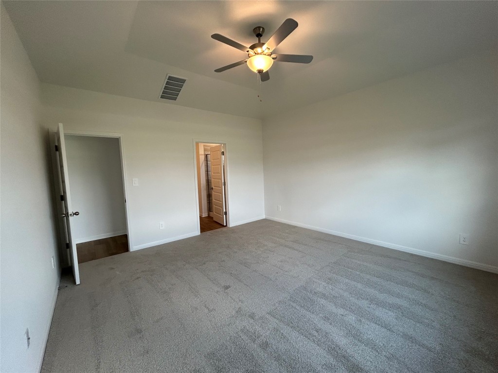 4304 Forel Road Pflugerville, TX 78660 - Photo 9 of 9 Unfurnished bedroom featuring carpet and ceiling fan