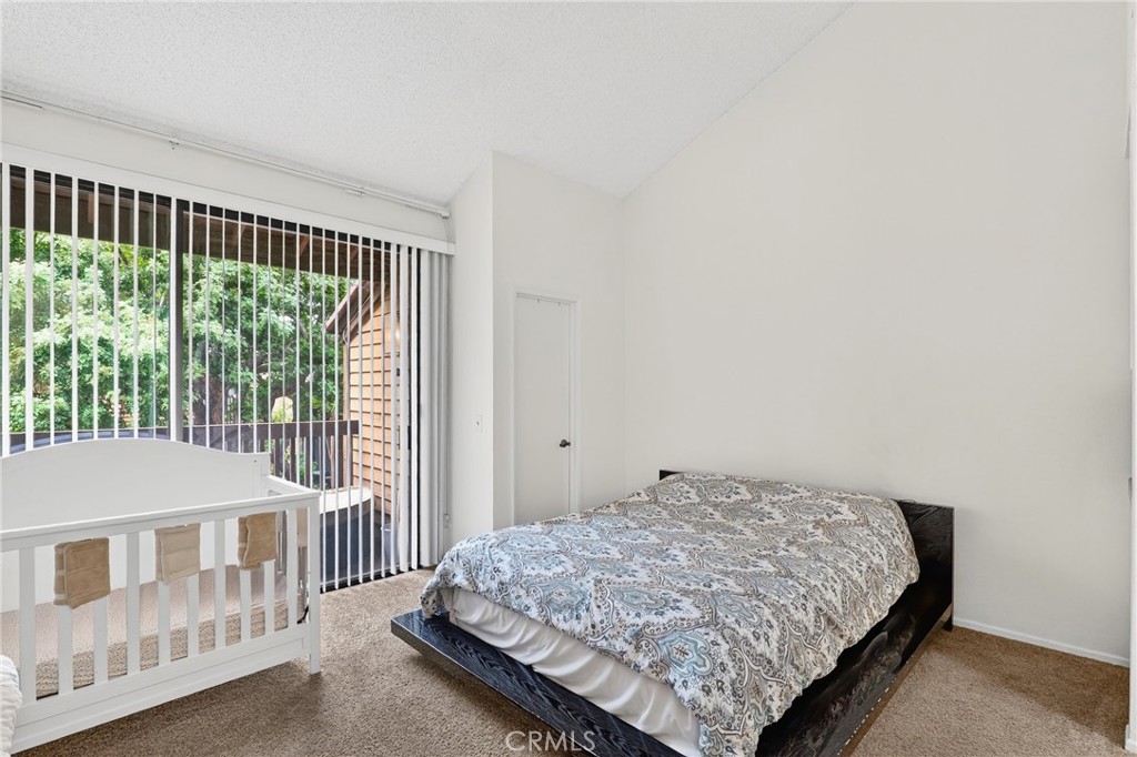 4140 Workman Mill Road, Unit 26 Whittier, CA 90601 - Photo 12 of 30 a bedroom with a bed and a window
