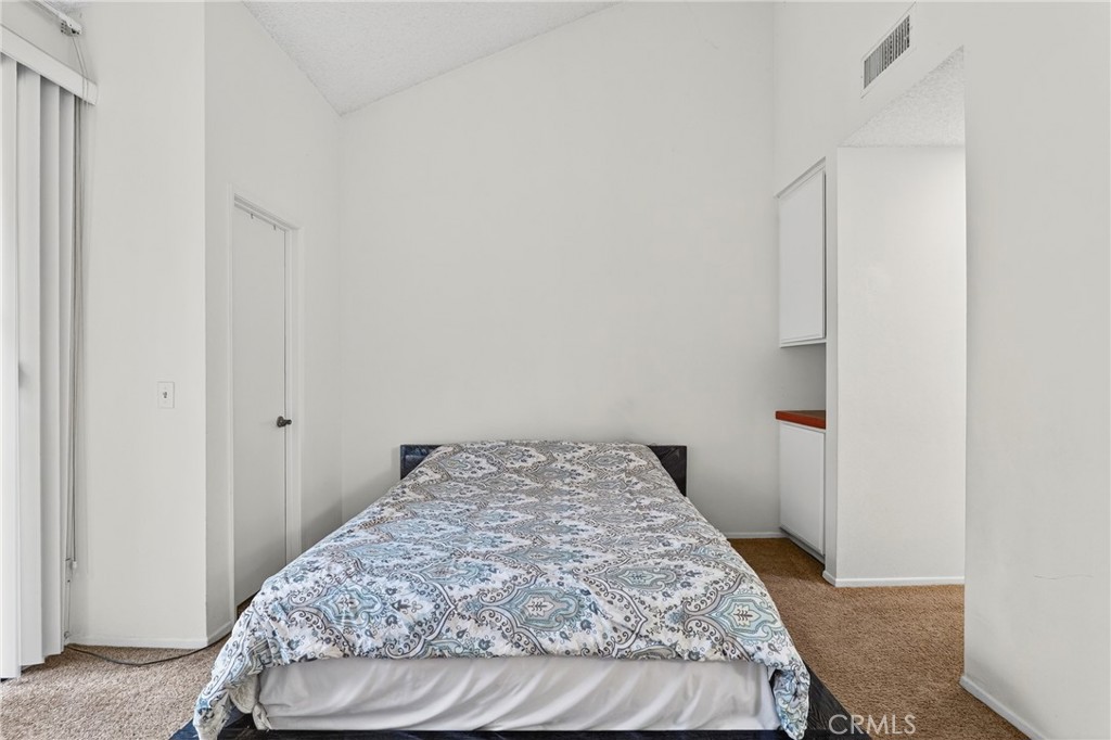 4140 Workman Mill Road, Unit 26 Whittier, CA 90601 - Photo 13 of 30 a bedroom with a bed and a window
