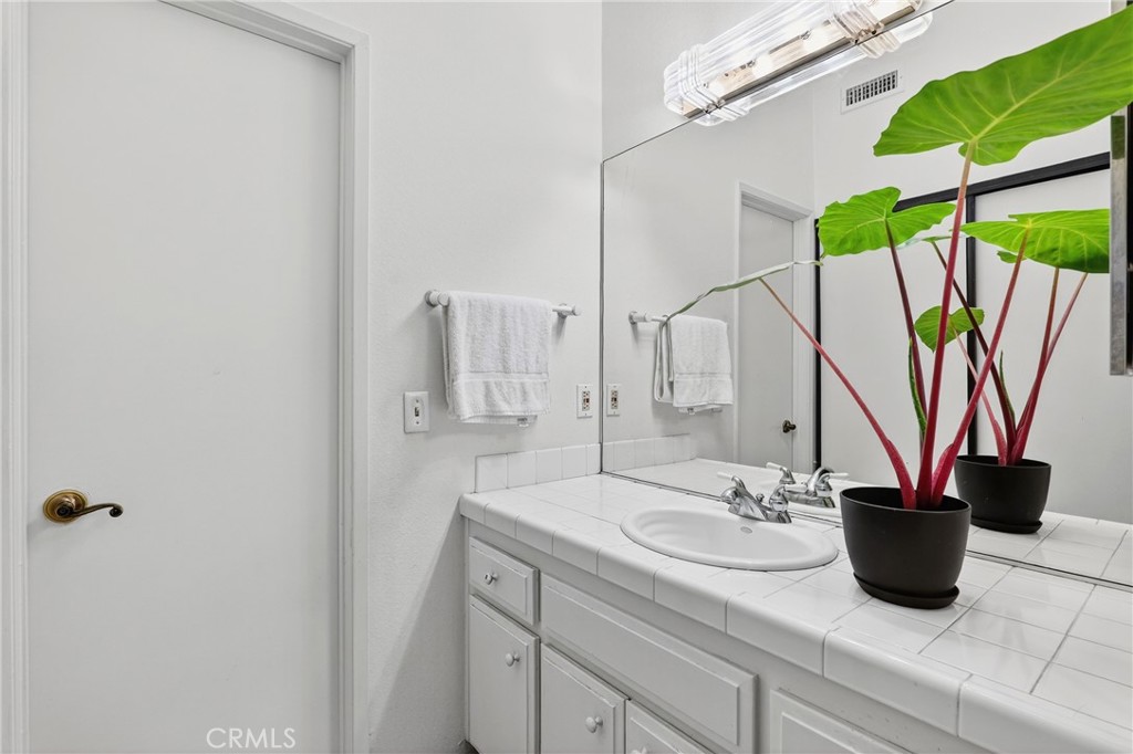 4140 Workman Mill Road, Unit 26 Whittier, CA 90601 - Photo 15 of 30 a bathroom with a sink and a mirror
