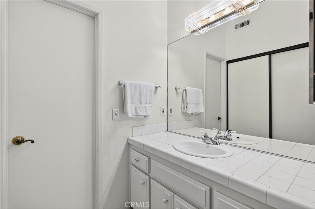 4140 Workman Mill Road, Unit 26 Whittier, CA 90601 - Photo 16 of 30 a bathroom with a sink and a mirror