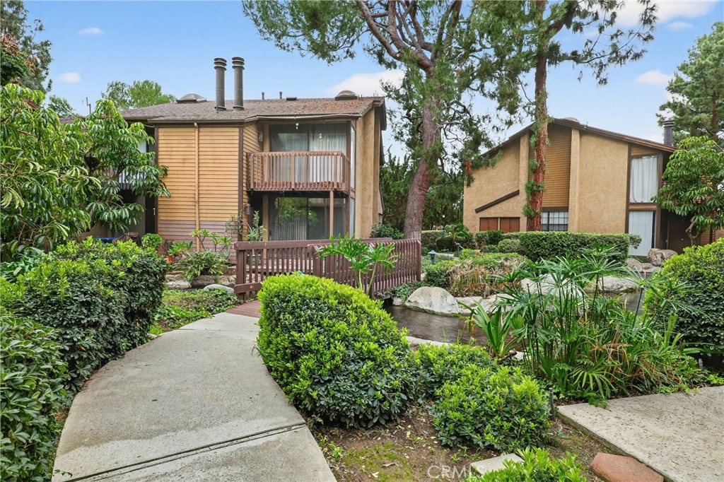 4140 Workman Mill Road, Unit 26 Whittier, CA 90601 - Photo 19 of 30 a front view of a house with garden