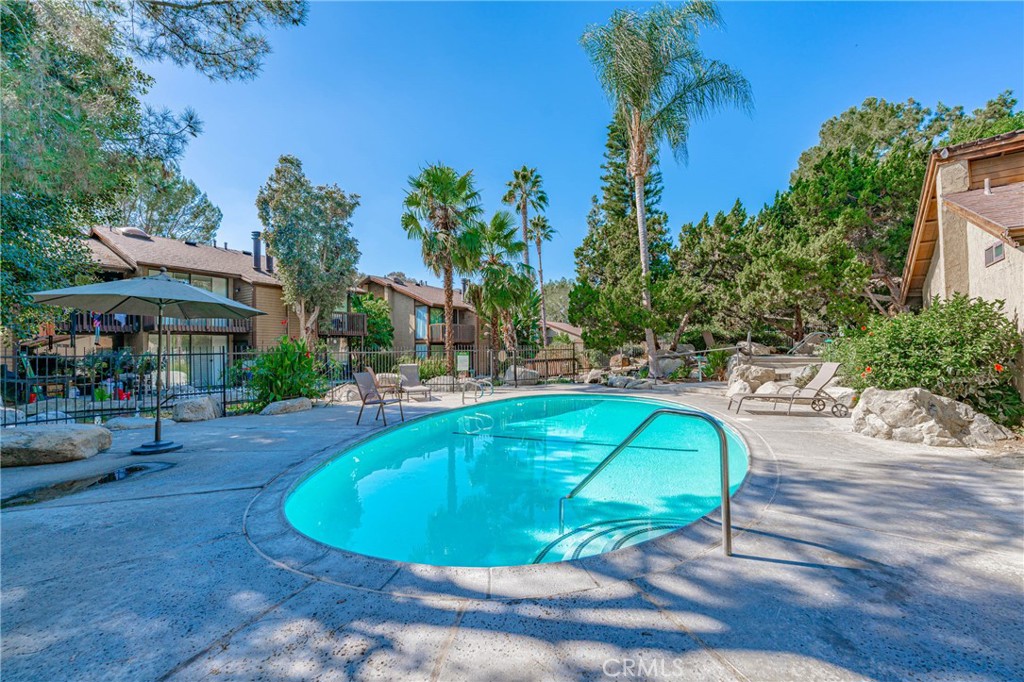 4140 Workman Mill Road, Unit 26 Whittier, CA 90601 - Photo 24 of 30 a view of a swimming pool with a patio