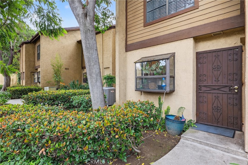 4140 Workman Mill Road, Unit 26 Whittier, CA 90601 - Photo 3 of 30 a view of a house with potted plants