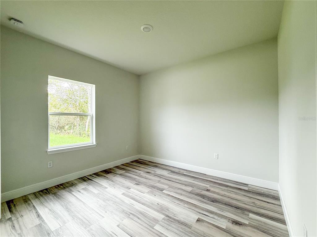 15716 Southwest 46th Ave Road Ocala, FL 34473 - Photo 13 of 31 an empty room with a window