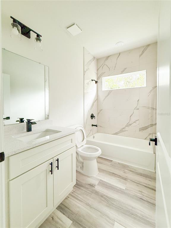 15716 Southwest 46th Ave Road Ocala, FL 34473 - Photo 17 of 31 a bathroom with a sink a toilet and a bathtub