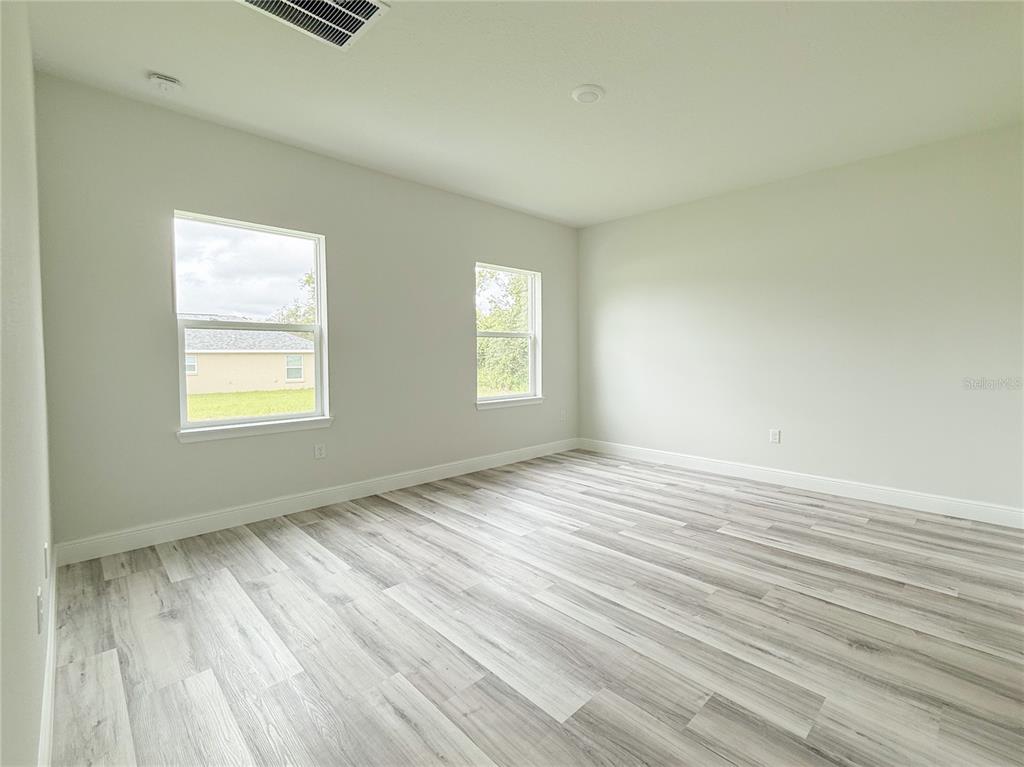 15716 Southwest 46th Ave Road Ocala, FL 34473 - Photo 21 of 31 a view of an empty room and window