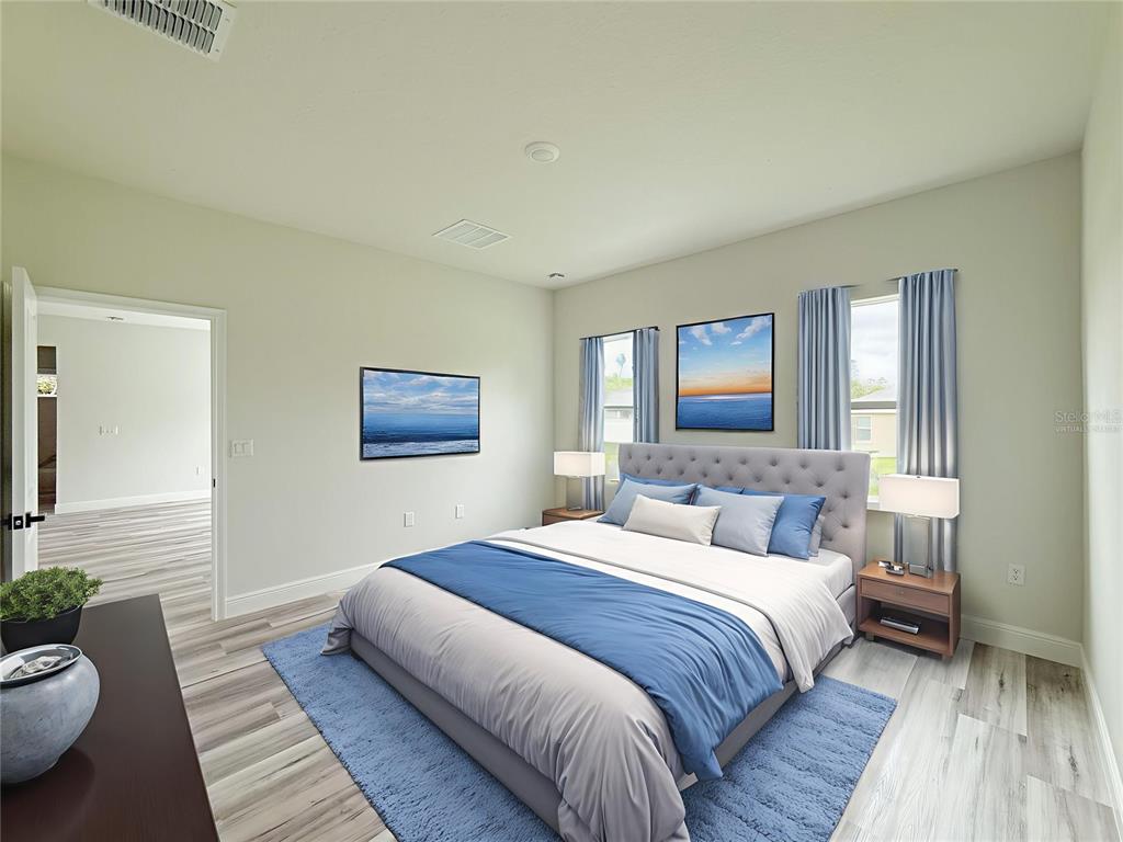 15716 Southwest 46th Ave Road Ocala, FL 34473 - Photo 31 of 31 a bedroom with a bed and a couch