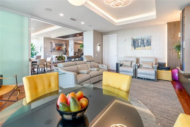 a kitchen with stainless steel appliances granite countertop a sink refrigerator and cabinets