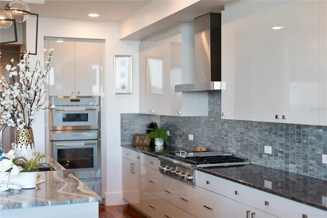 a view of a porch with a door and a chair