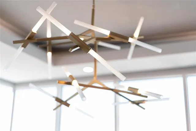 a living room with stainless steel appliances granite countertop furniture and a rug
