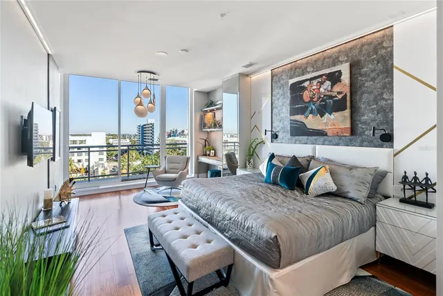 a bathroom with a granite countertop sink a mirror and a shower