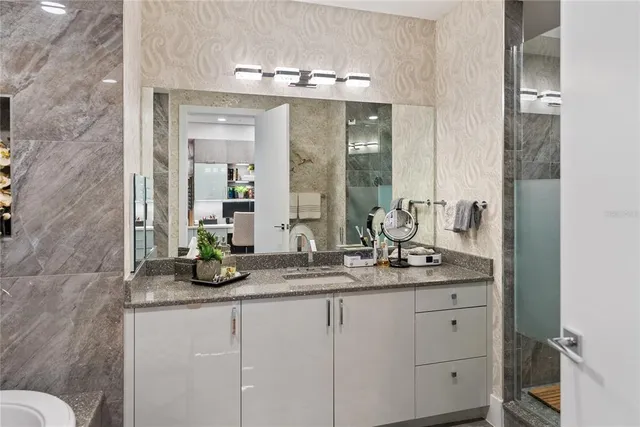 a living room with furniture and flat screen tv