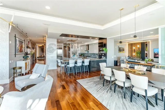 a large white kitchen with a large window