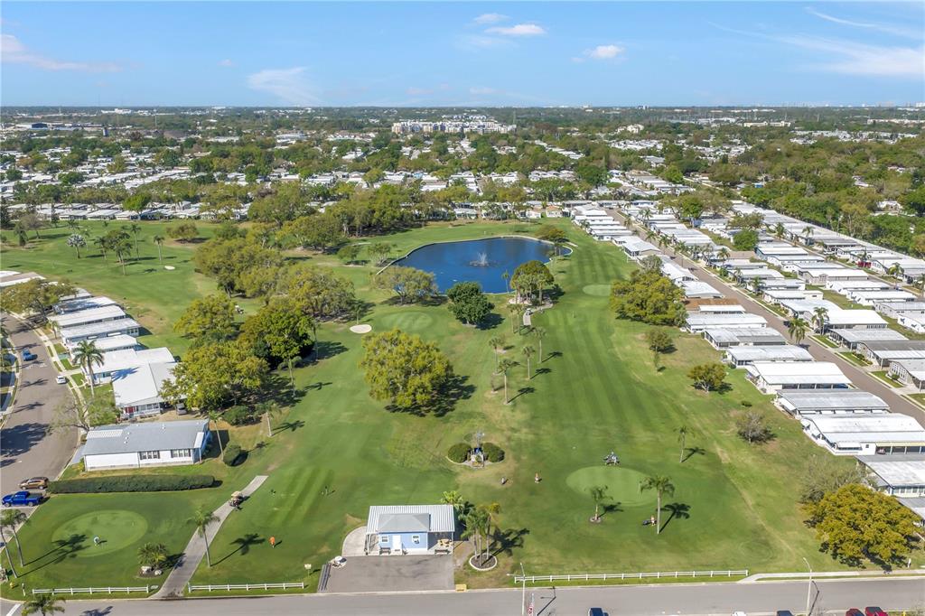 1100 South Belcher Road, Unit 502 Largo, FL 33771 - Photo 47 of 51 an aerial view of residential houses with outdoor space