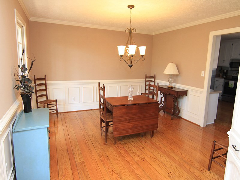 5016 Trail Ridge Drive Raleigh, NC 27613 - Photo 6 of 25 The formal dining room will accommodate a large table that will seat 10 or 12 easily. Beautiful wood floors. Dining Room