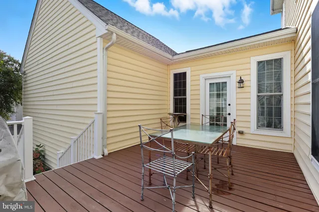 a view of a patio with a table and chairs