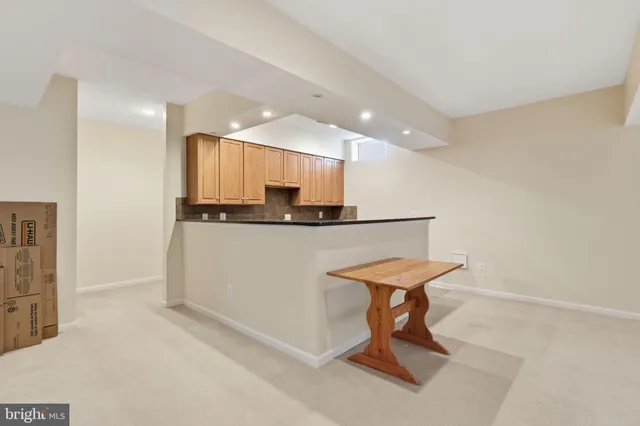 a room with a table and chairs in it