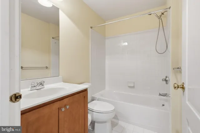 a bathroom with a sink mirror toilet and shower