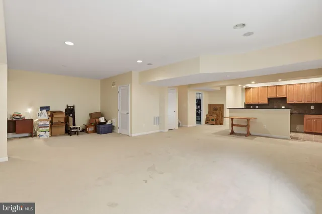 a view of a livingroom with furniture and an empty room
