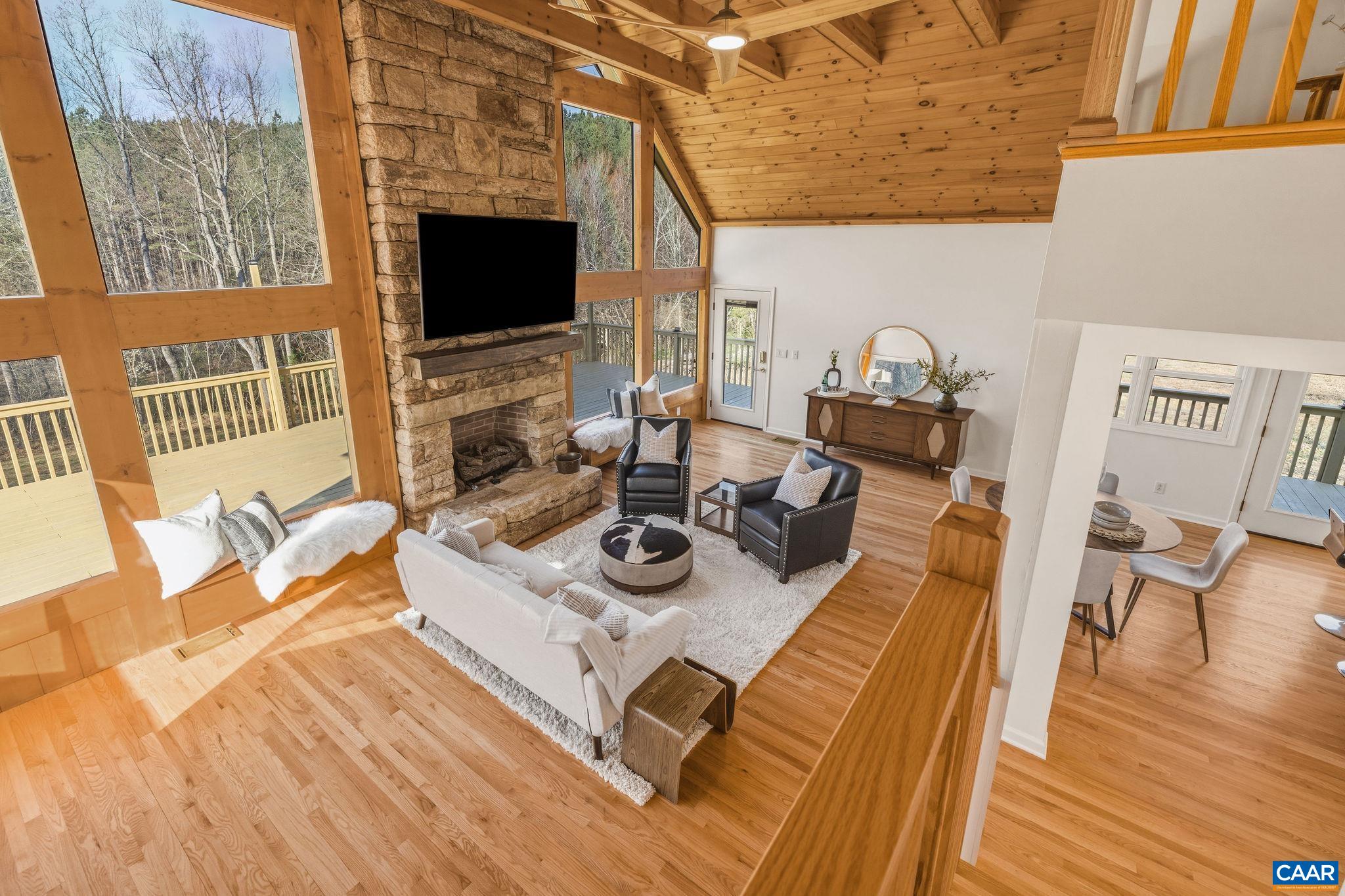 7102 Blackwells Hollow Road Crozet, VA 22932 - Photo 12 of 57 a view of a dining room with furniture and wooden floor