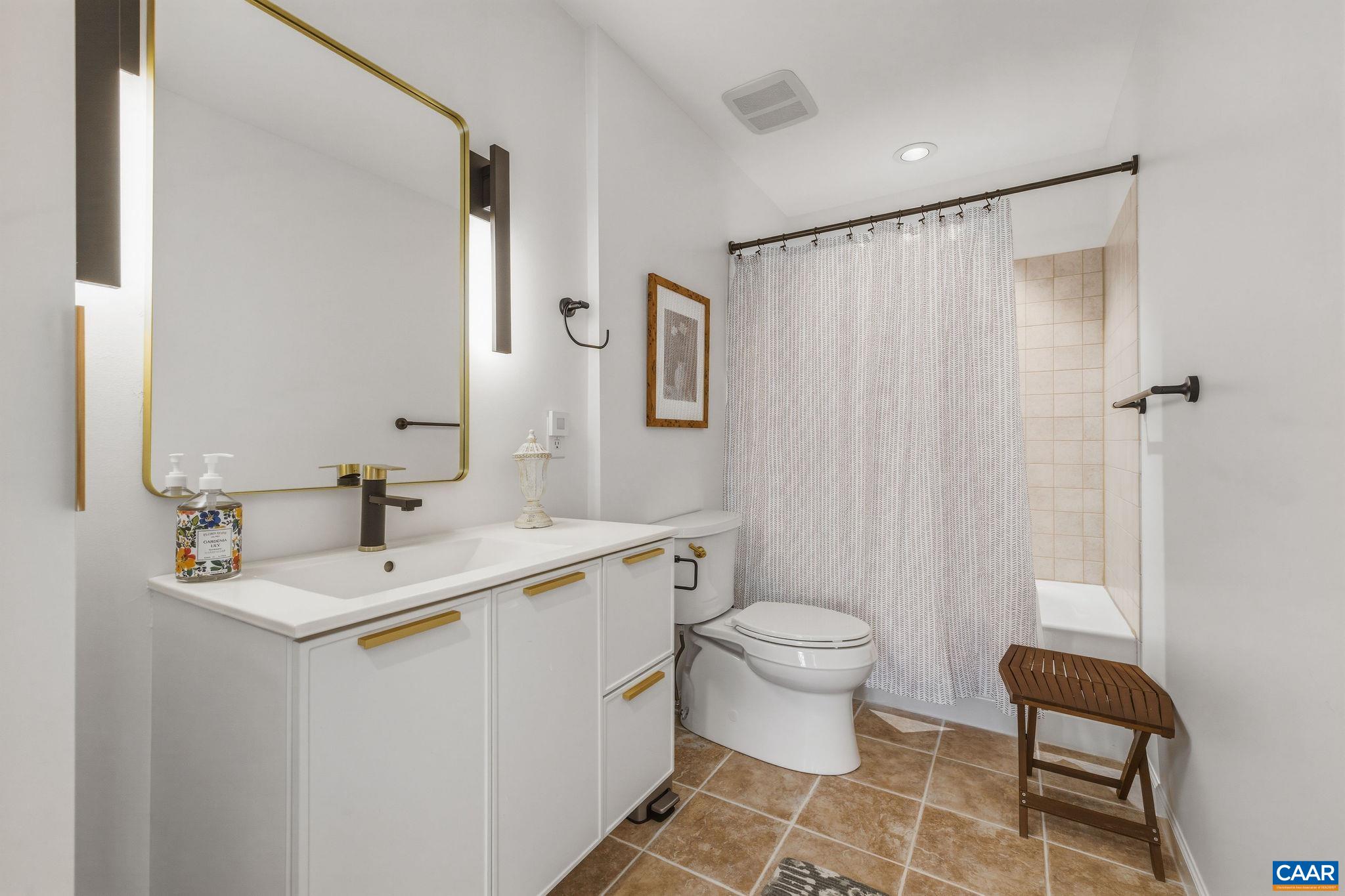 7102 Blackwells Hollow Road Crozet, VA 22932 - Photo 17 of 57 a bathroom with a sink toilet and shower