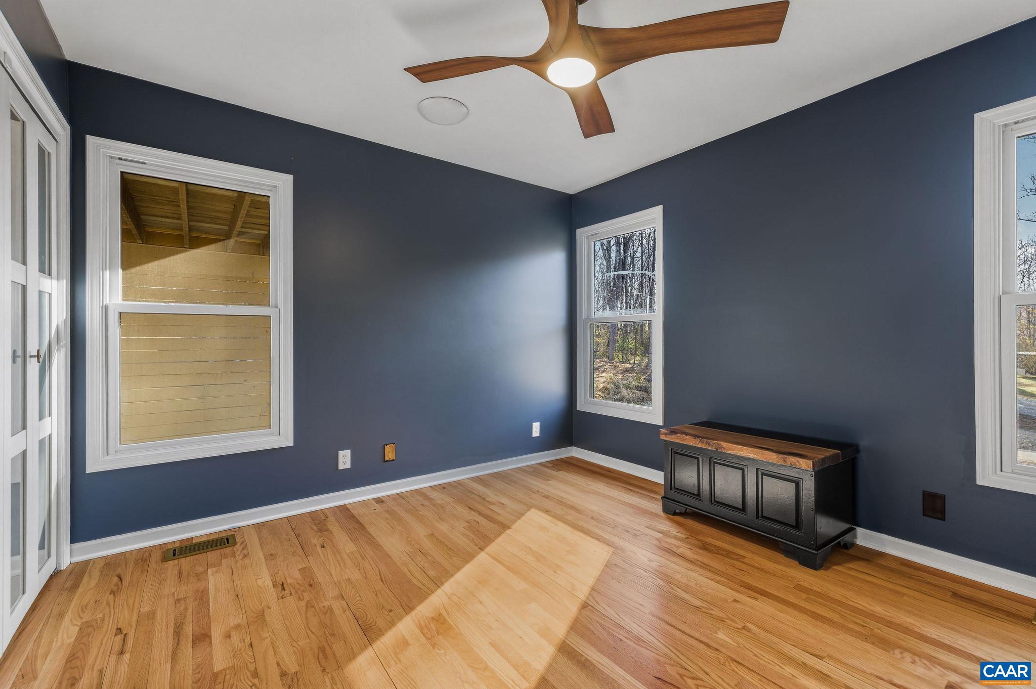 7102 Blackwells Hollow Road Crozet, VA 22932 - Photo 18 of 57 a bedroom with a bed and a window