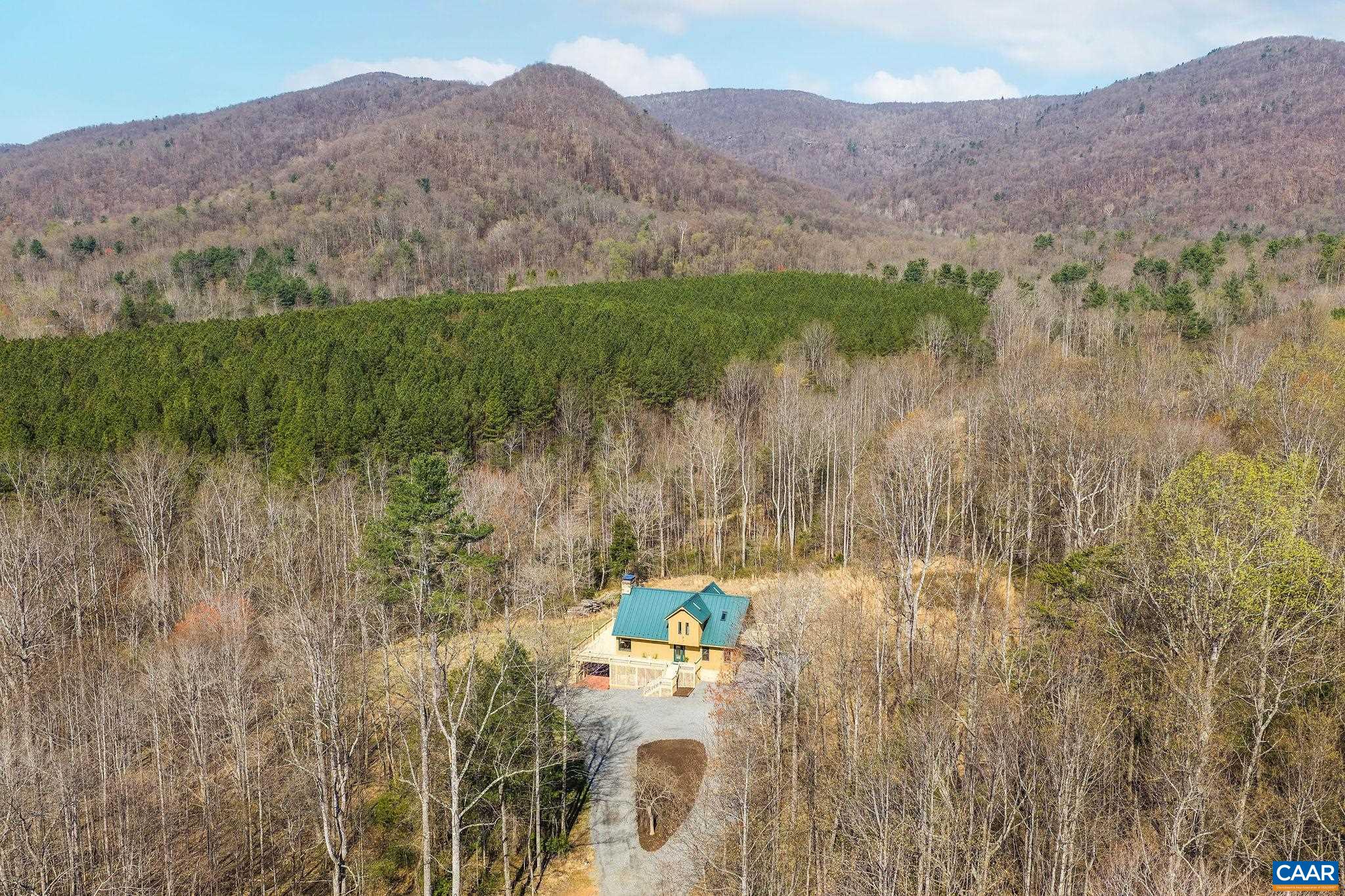 7102 Blackwells Hollow Road Crozet, VA 22932 - Photo 2 of 57 a view of a lake with a mountain in the background