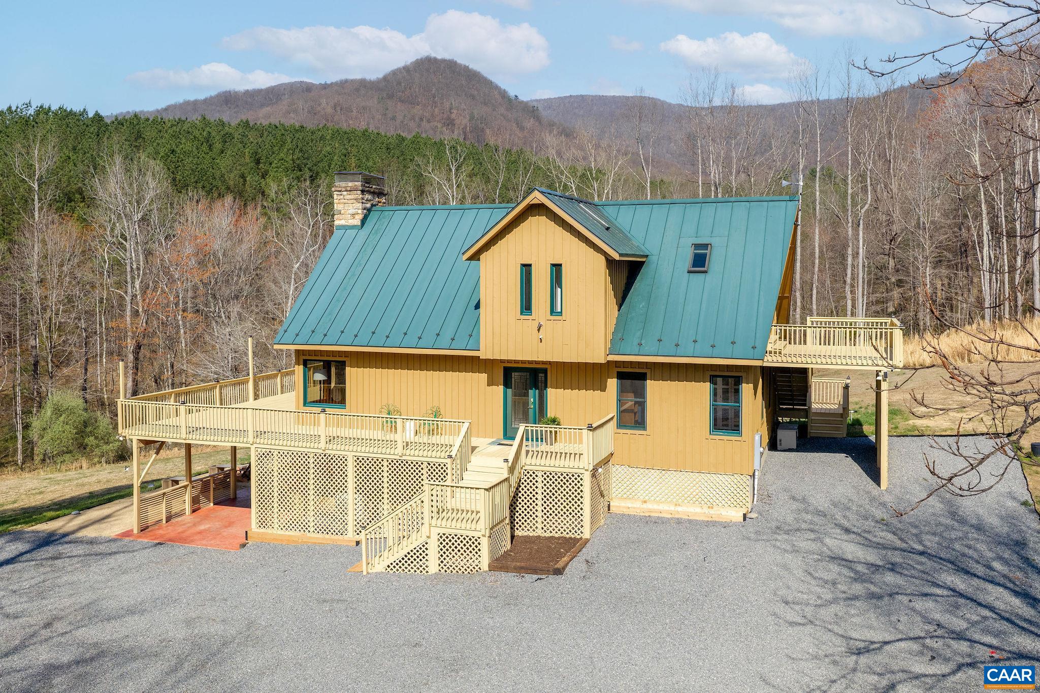 7102 Blackwells Hollow Road Crozet, VA 22932 - Photo 3 of 57 an aerial view of a house with a yard and a large tree
