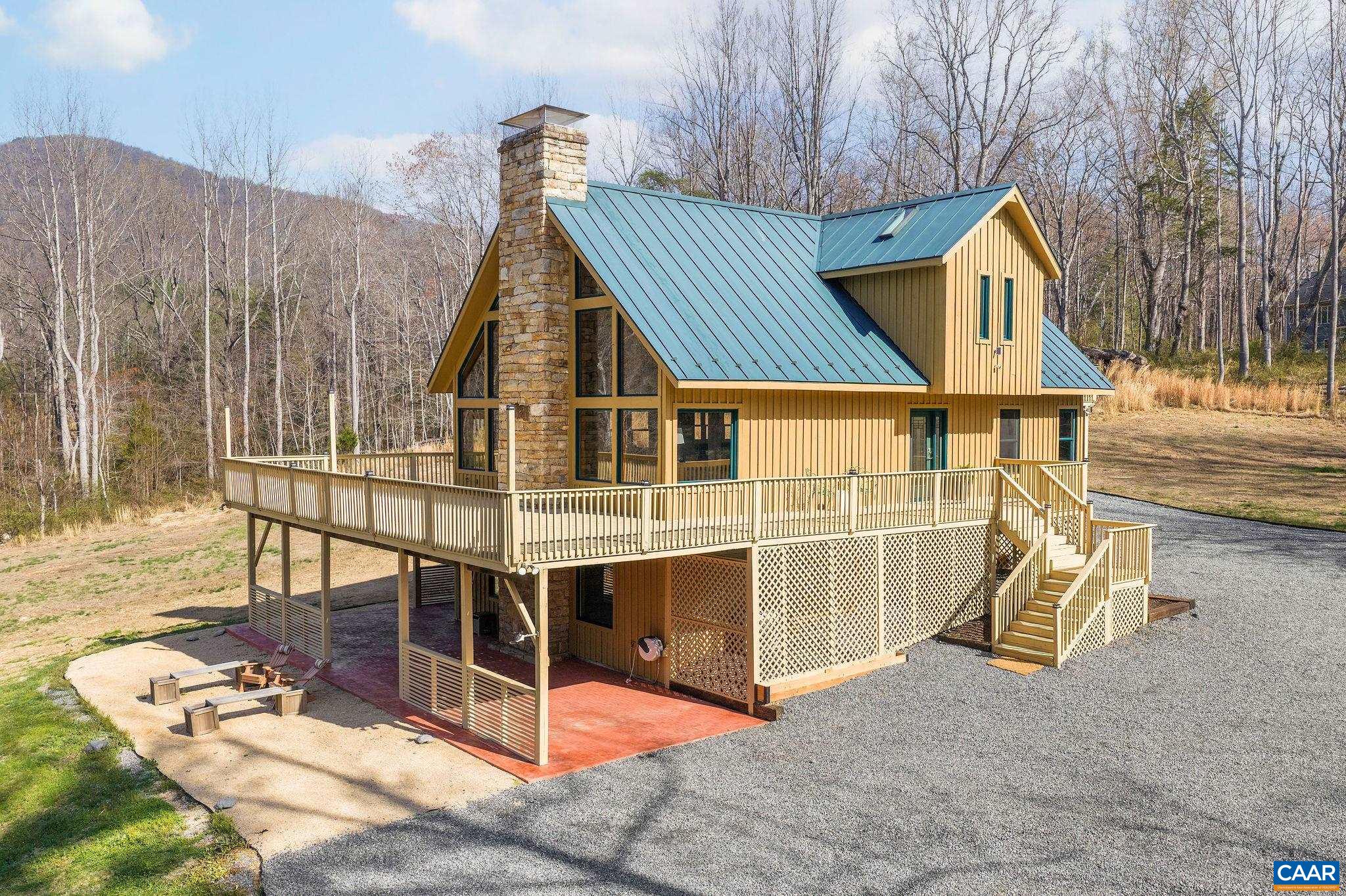 7102 Blackwells Hollow Road Crozet, VA 22932 - Photo 44 of 57 a view of a house with backyard