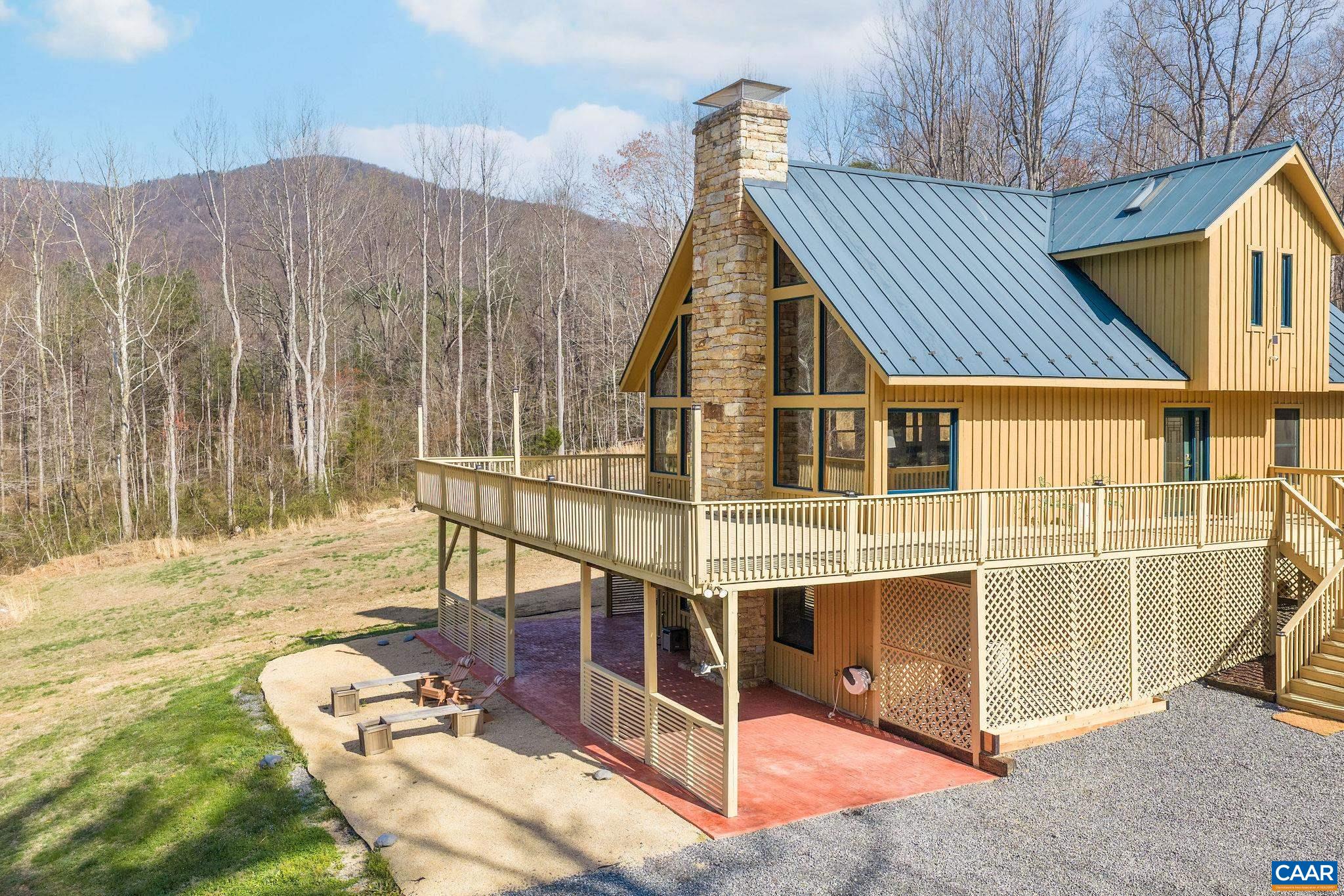 7102 Blackwells Hollow Road Crozet, VA 22932 - Photo 45 of 57 a view of a house with backyard and porch