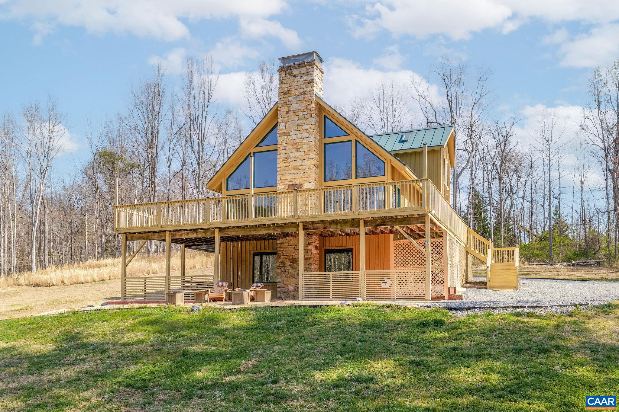 7102 Blackwells Hollow Road Crozet, VA 22932 - Photo 47 of 57 a view of a house with a yard and plants
