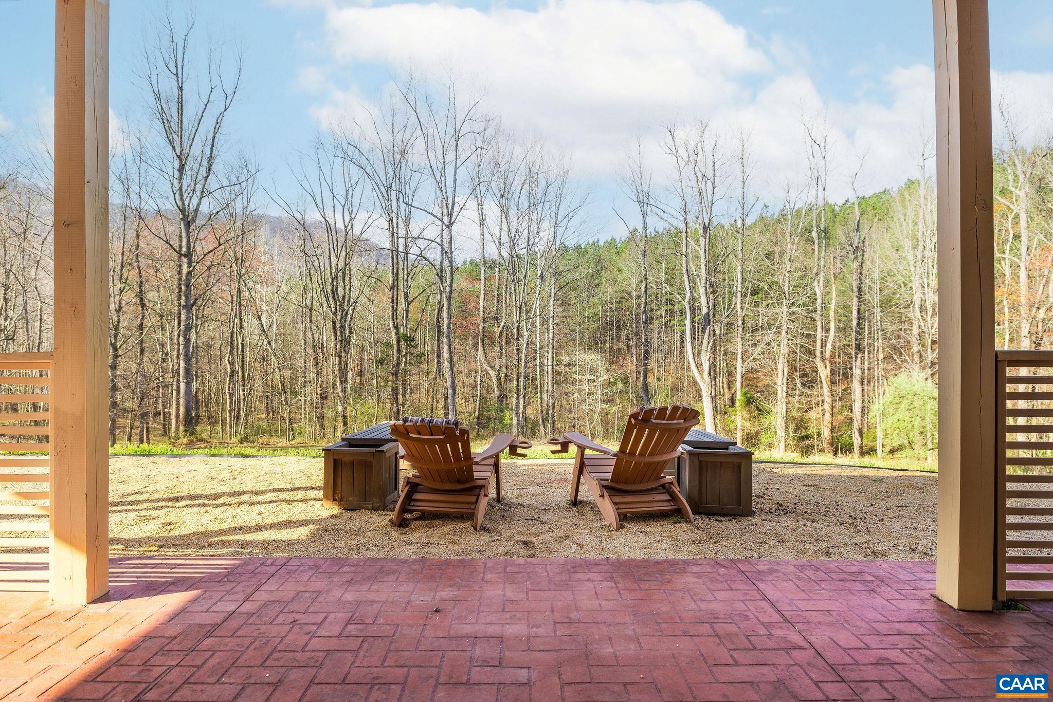 7102 Blackwells Hollow Road Crozet, VA 22932 - Photo 54 of 57 a view of patio with a table and chairs and couches