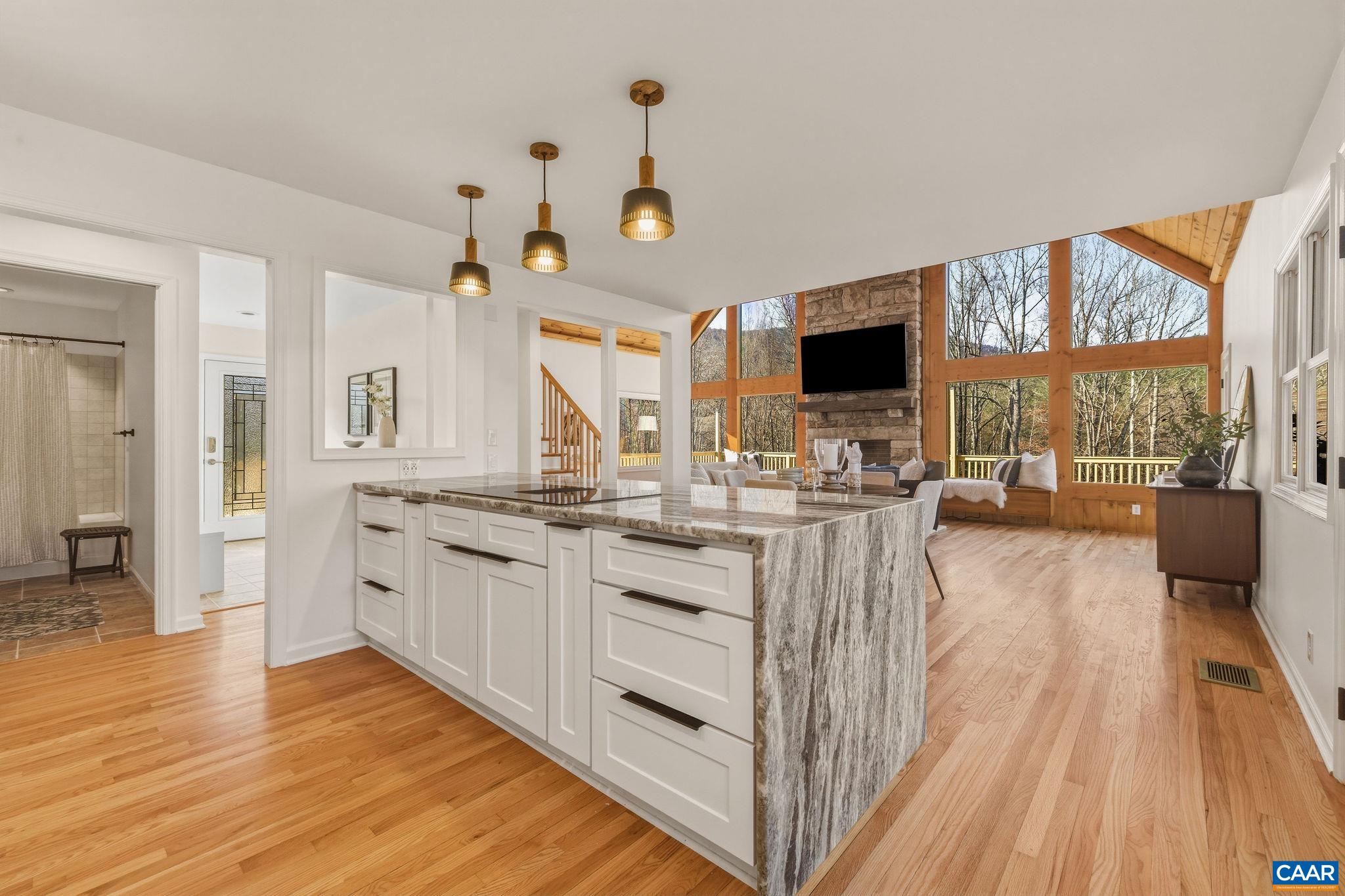 7102 Blackwells Hollow Road Crozet, VA 22932 - Photo 10 of 57 a kitchen with stainless steel appliances granite countertop a stove and cabinets