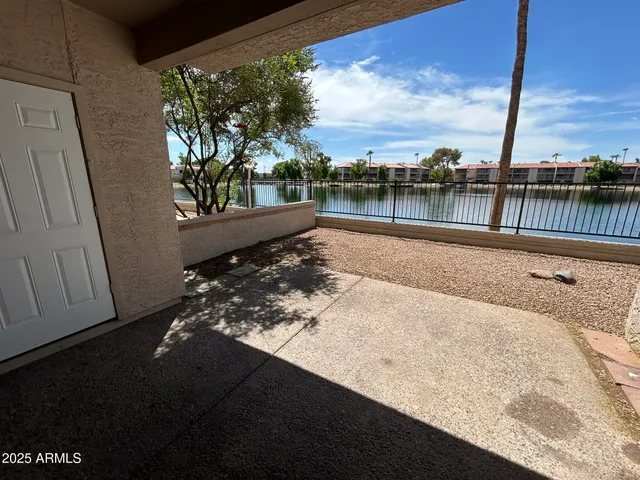 a view of a lake with houses in the back