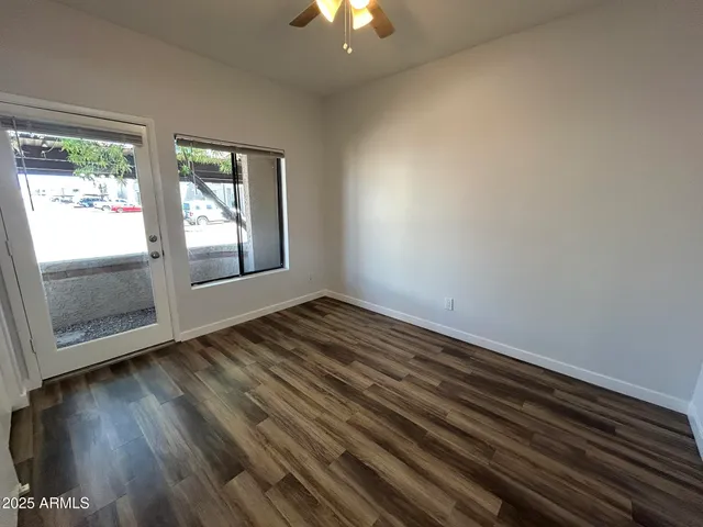 a view of a room with wooden floor