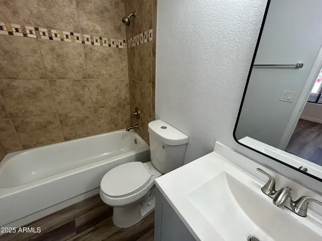 a view of a lake with a floor to ceiling window next to a yard