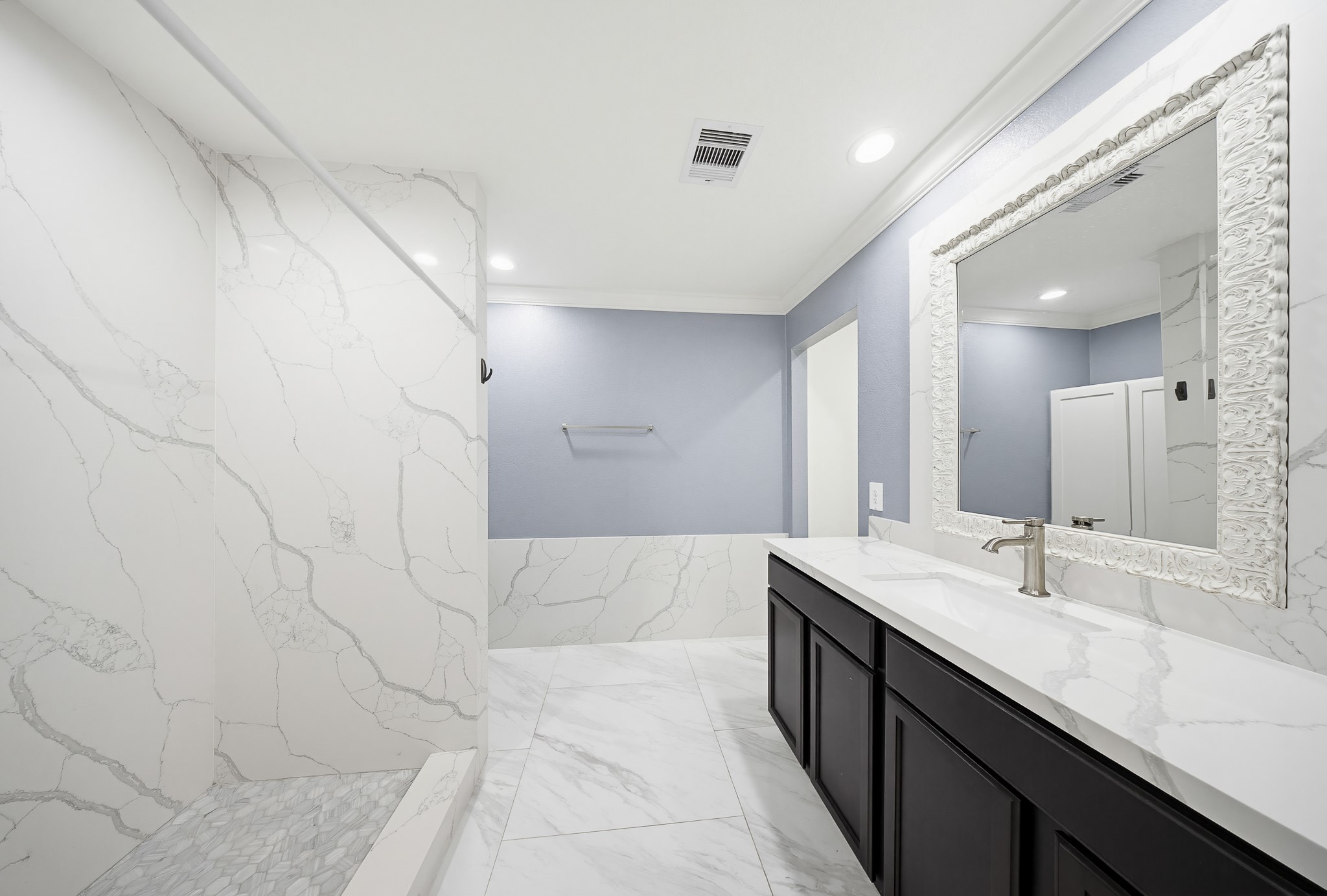 23210 Barberry Crk Trail Spring, TX 77373 - Photo 17 of 33 a spacious bathroom with a double vanity sink a mirror and a shower