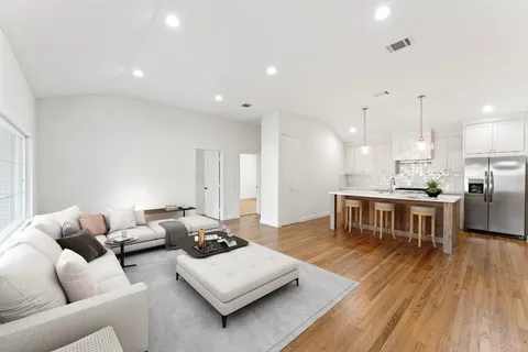 a living room with furniture and a table