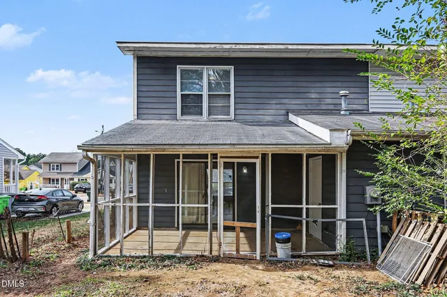 a bedroom with a bed and balcony