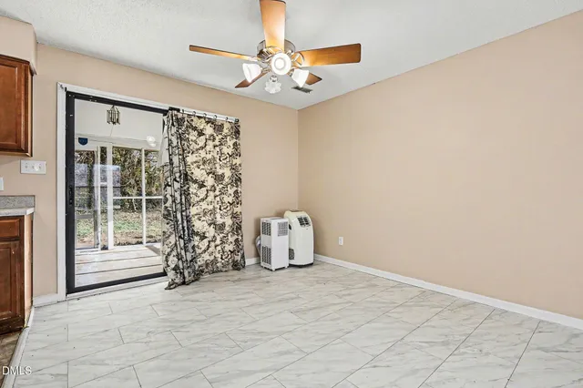 a view of livingroom with furniture and a window