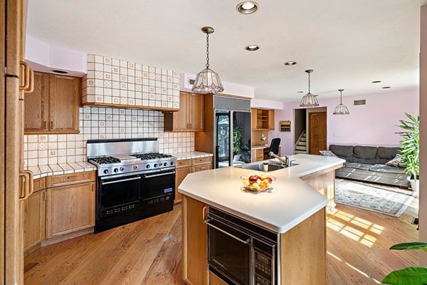 90 Holland Road Brookline, MA 02445 - Photo 16 of 35 a kitchen with stainless steel appliances granite countertop a stove and a sink