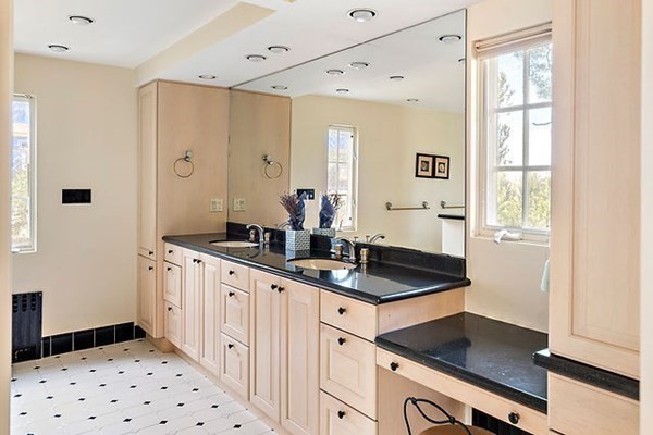 90 Holland Road Brookline, MA 02445 - Photo 25 of 35 a kitchen with granite countertop a sink stove and cabinets
