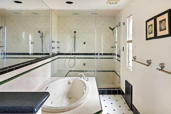 90 Holland Road Brookline, MA 02445 - Photo 26 of 35 a bathroom with a bathtub and a shower