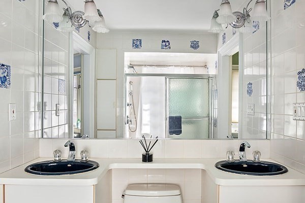 90 Holland Road Brookline, MA 02445 - Photo 32 of 35 a bathroom with a sink and a mirror