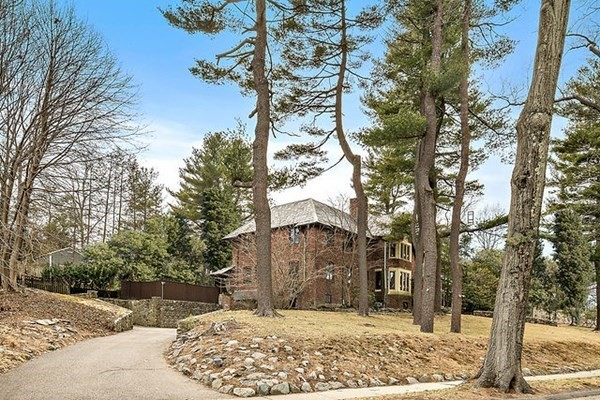 90 Holland Road Brookline, MA 02445 - Photo 4 of 35 a view of a house with snow on the tree