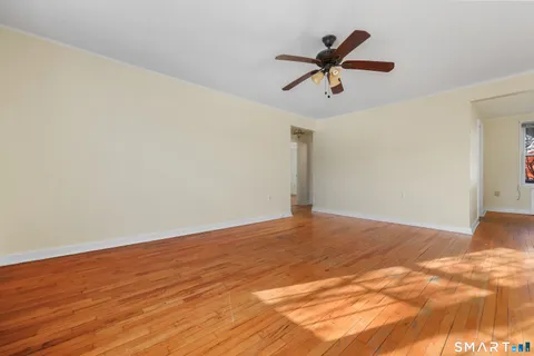 a view of a ceiling fan with wooden floor